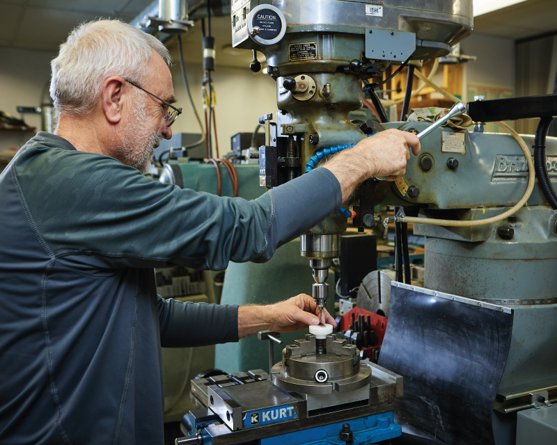 a machinist using a piece of equipment