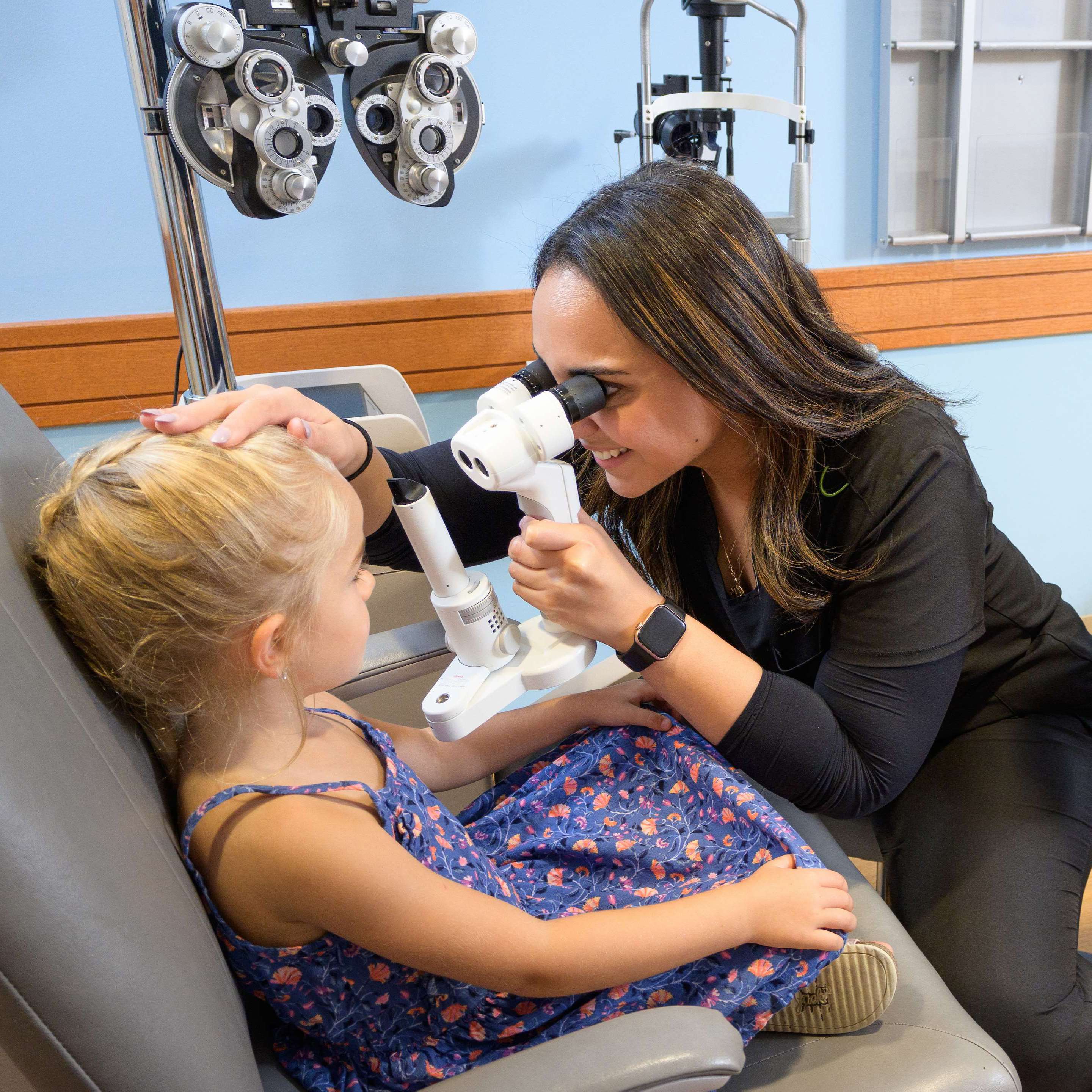 Ophthalmology Resident examining pediatric patient