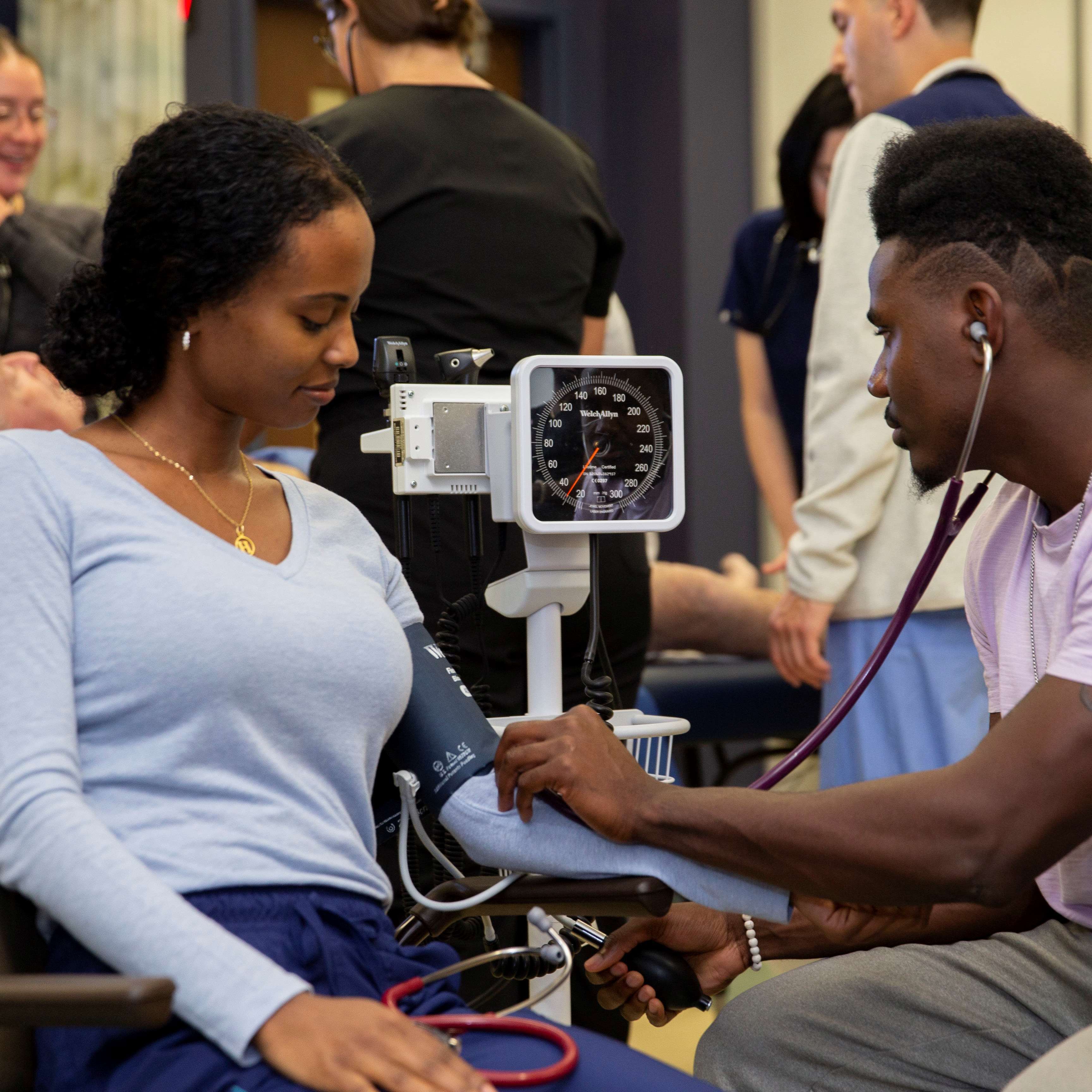 Woman getting her blood pressure taken