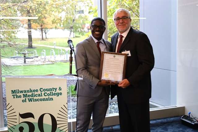 County Executive David Crowley presents proclamation to Dr. Riccardo Colella, Division Chief, EMS Medicine, MCW