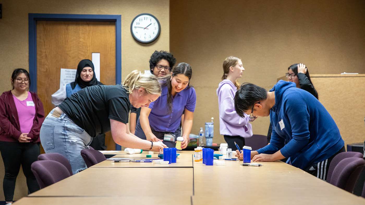 Students doing an educational activity in a conference room