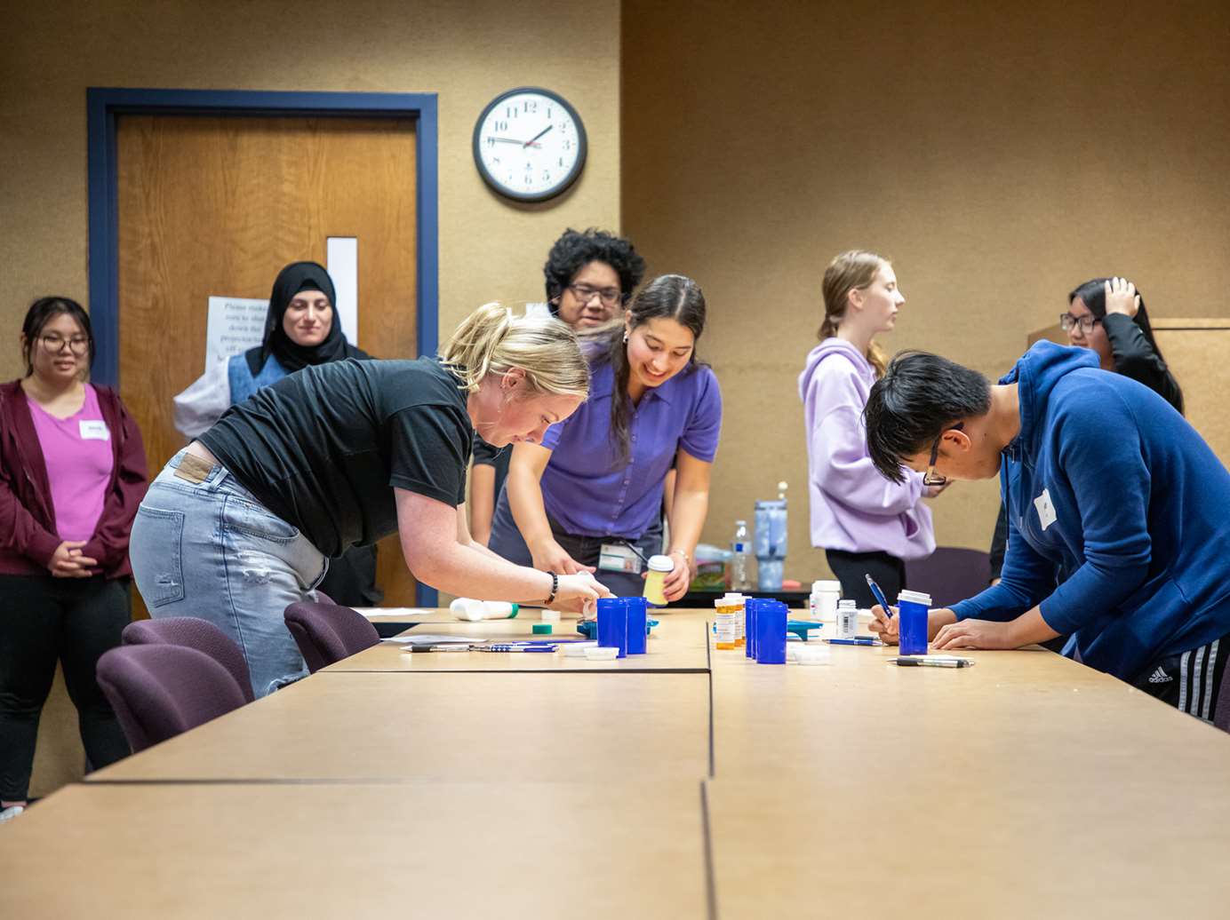 Students doing an educational activity in a conference room