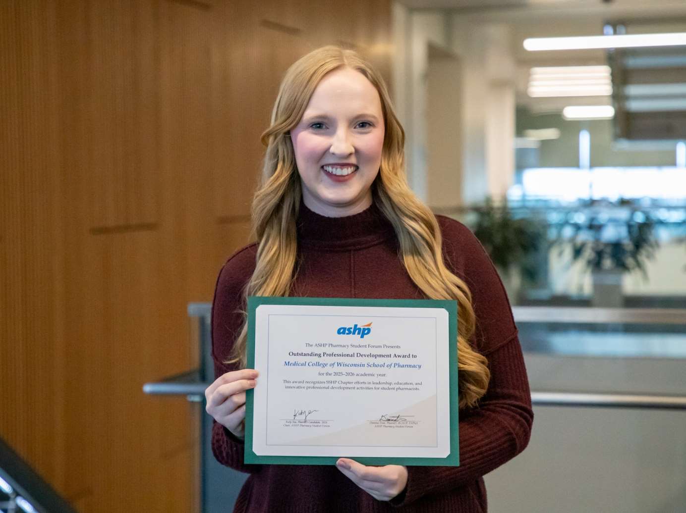 Maura Keenan holding award