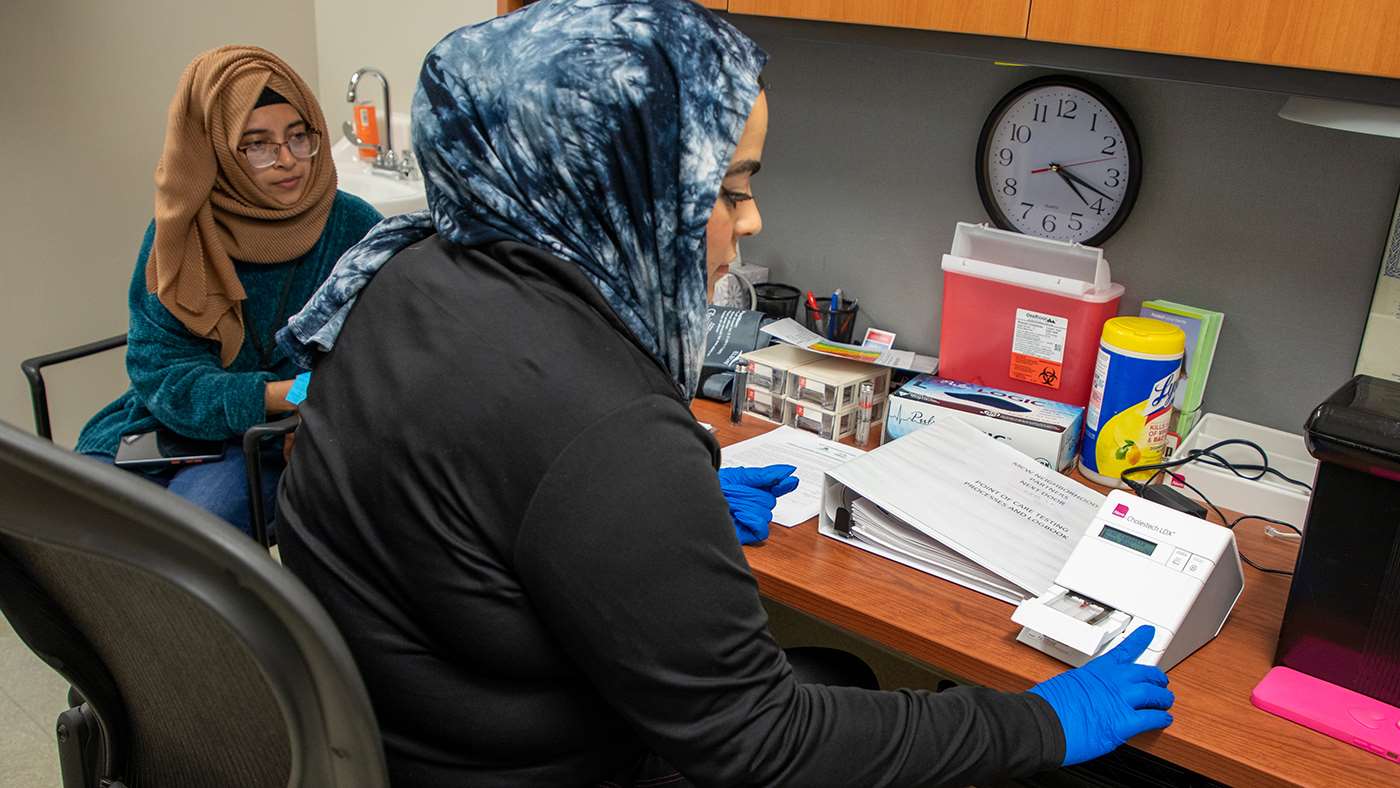 Two women reviewing test results