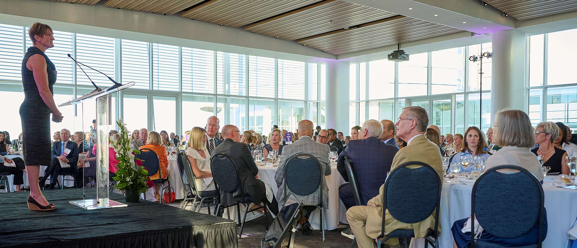 A woman speaking at an event