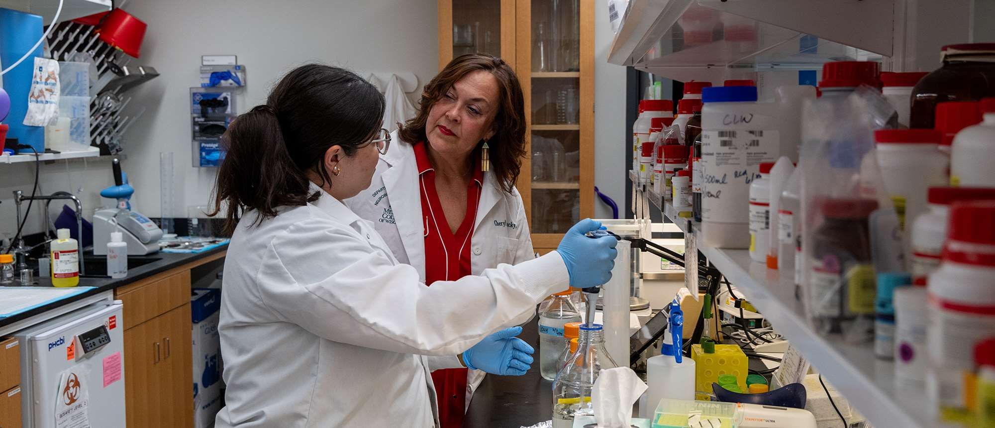 Cheryl Stucky, PhD (right) with female lab member