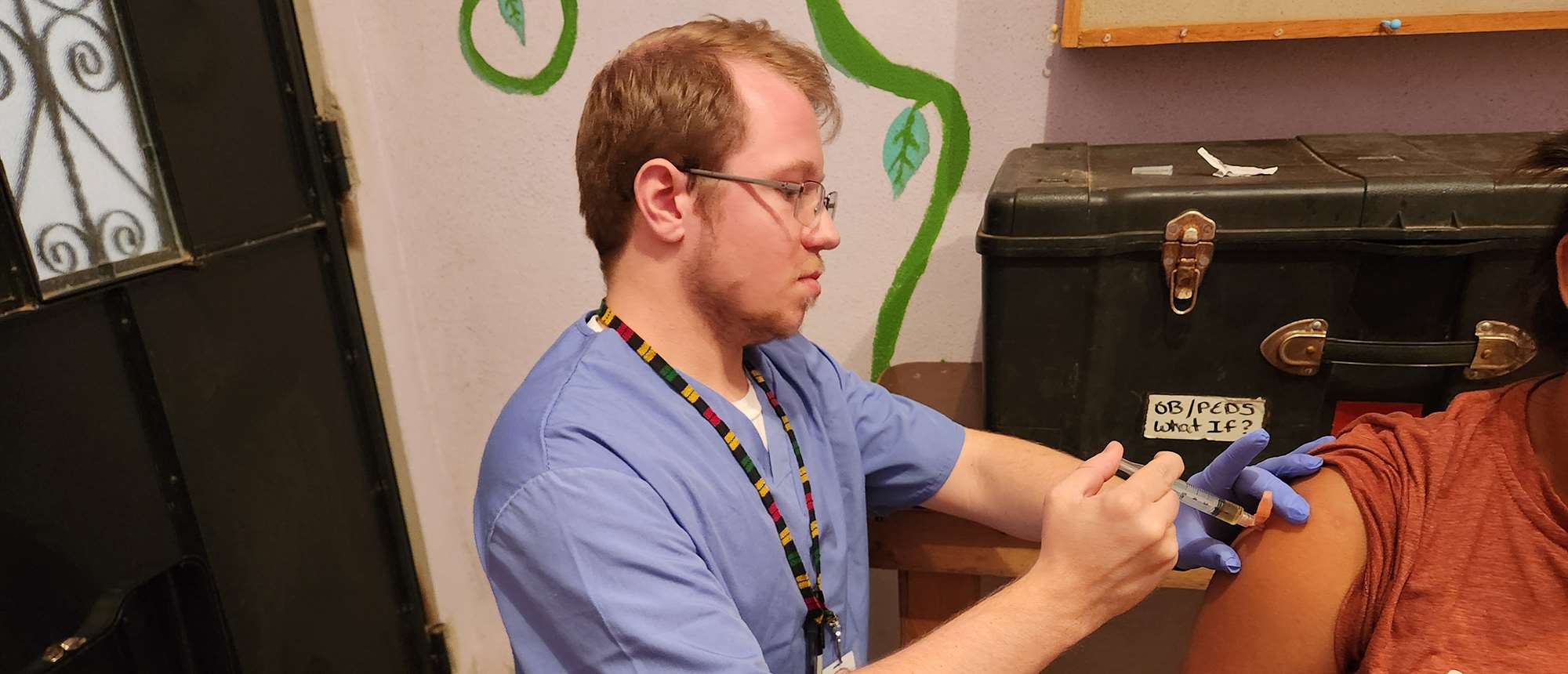Adam Crouse administering an injection