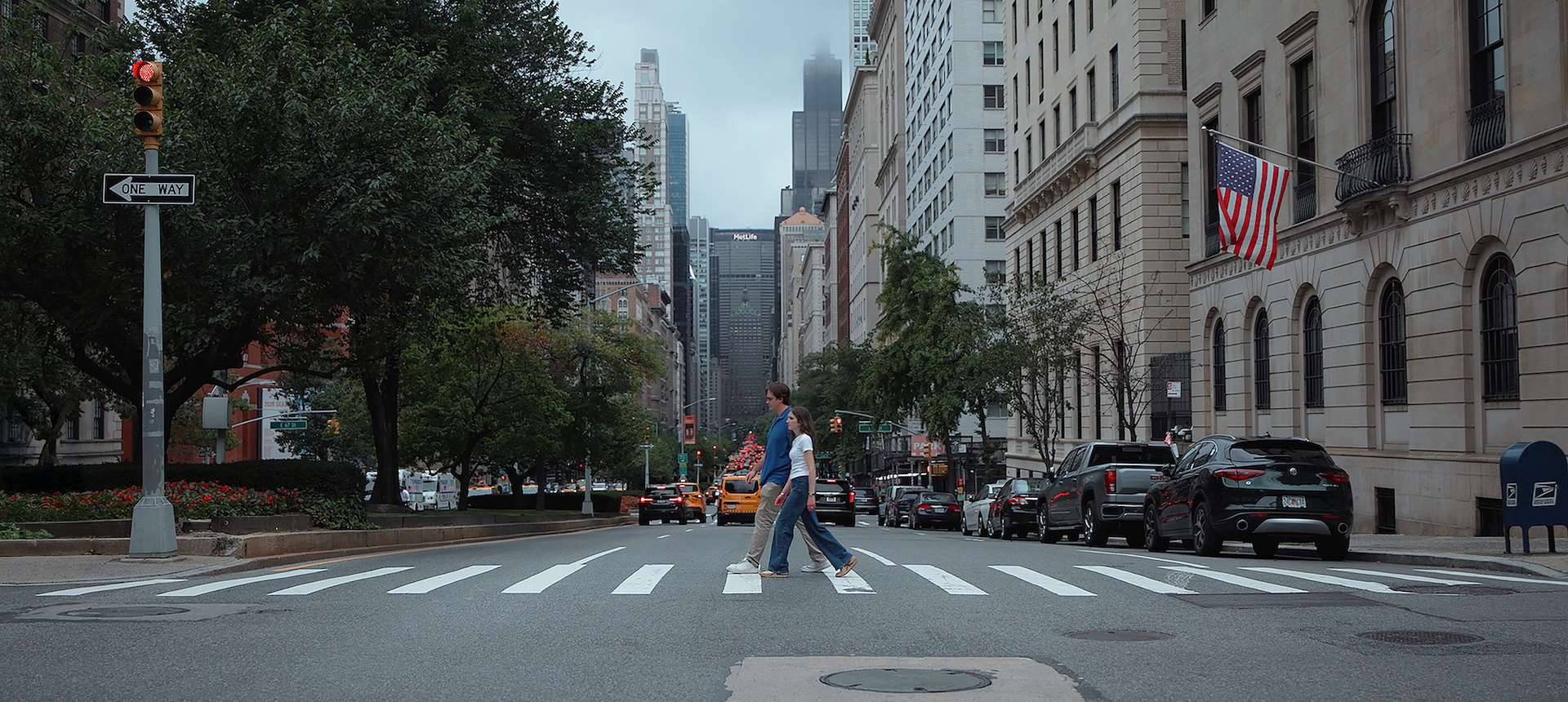 A woman and a man crossing a street in New York City
