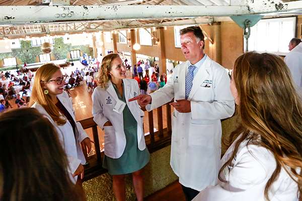 Anna Bauman speaking with Dean Kerschner at MCW-Central Wisconsin White Coat Ceremony