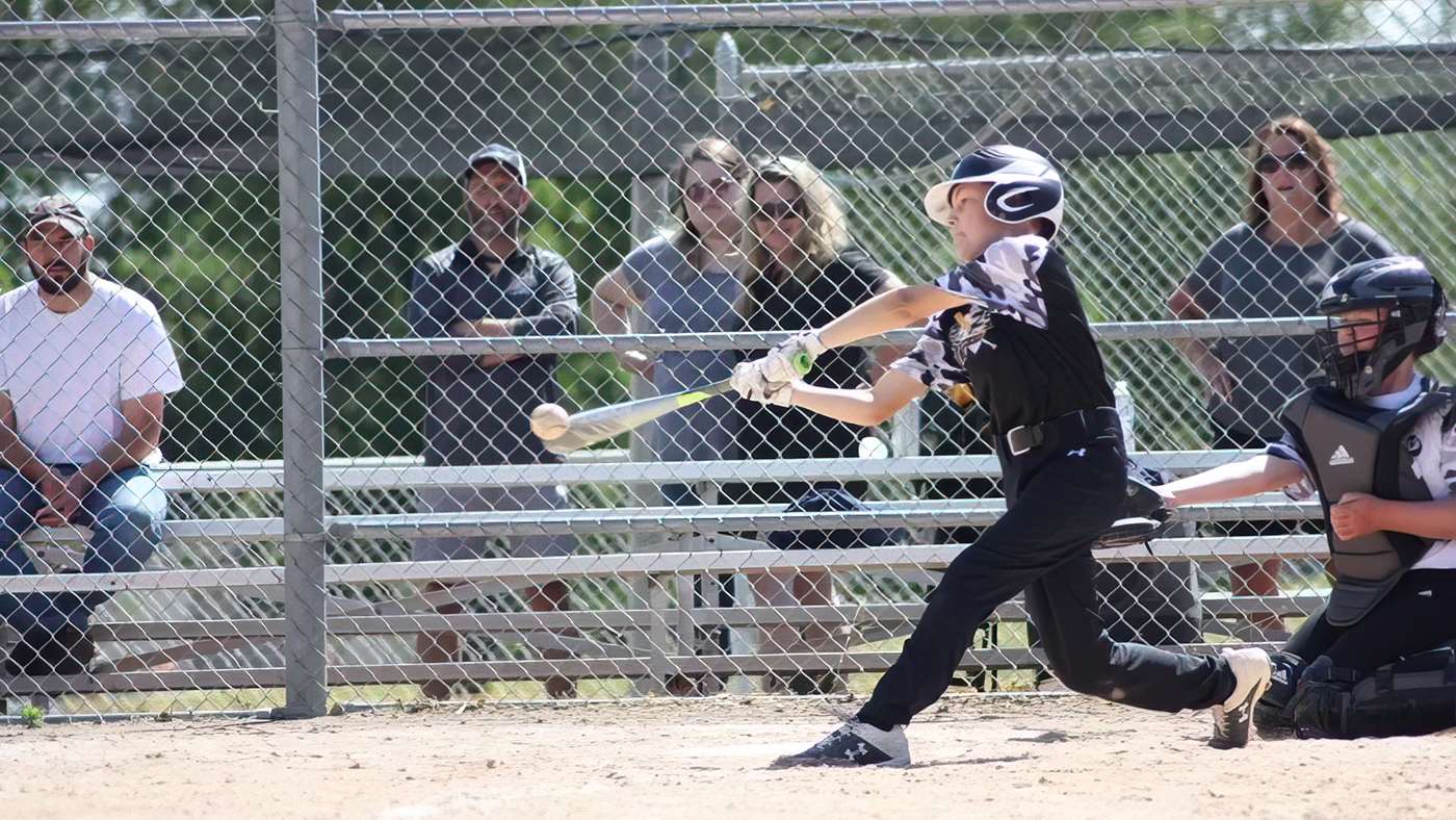 Auggie Tate playing baseball