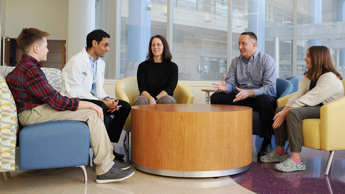 Auggie Tate and his family during a visit with Dr. Ankur Chugh