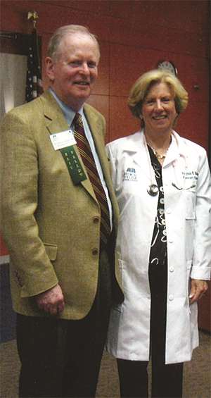 Ginny Bolger receives honorary white coat at alumni banquet in 2010