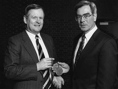 Mike Bolger congratulates Dr. Michael Dunn upon his installation as MCW Dean in 1995