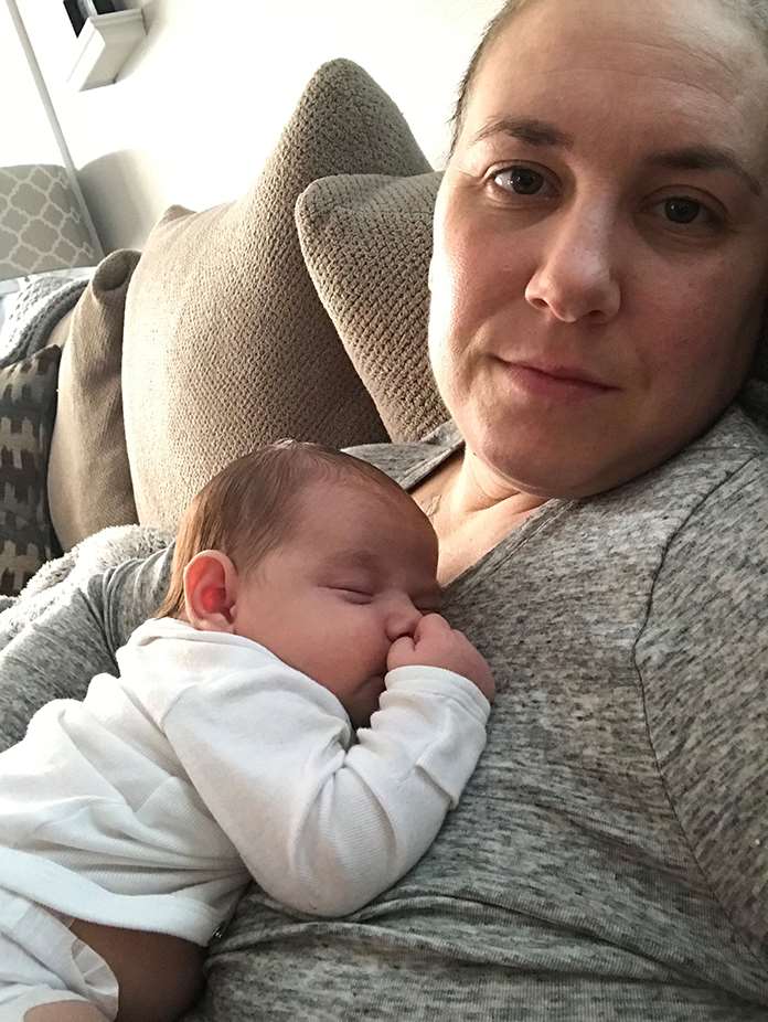 Breast cancer survivor Lauren Lanza with her child