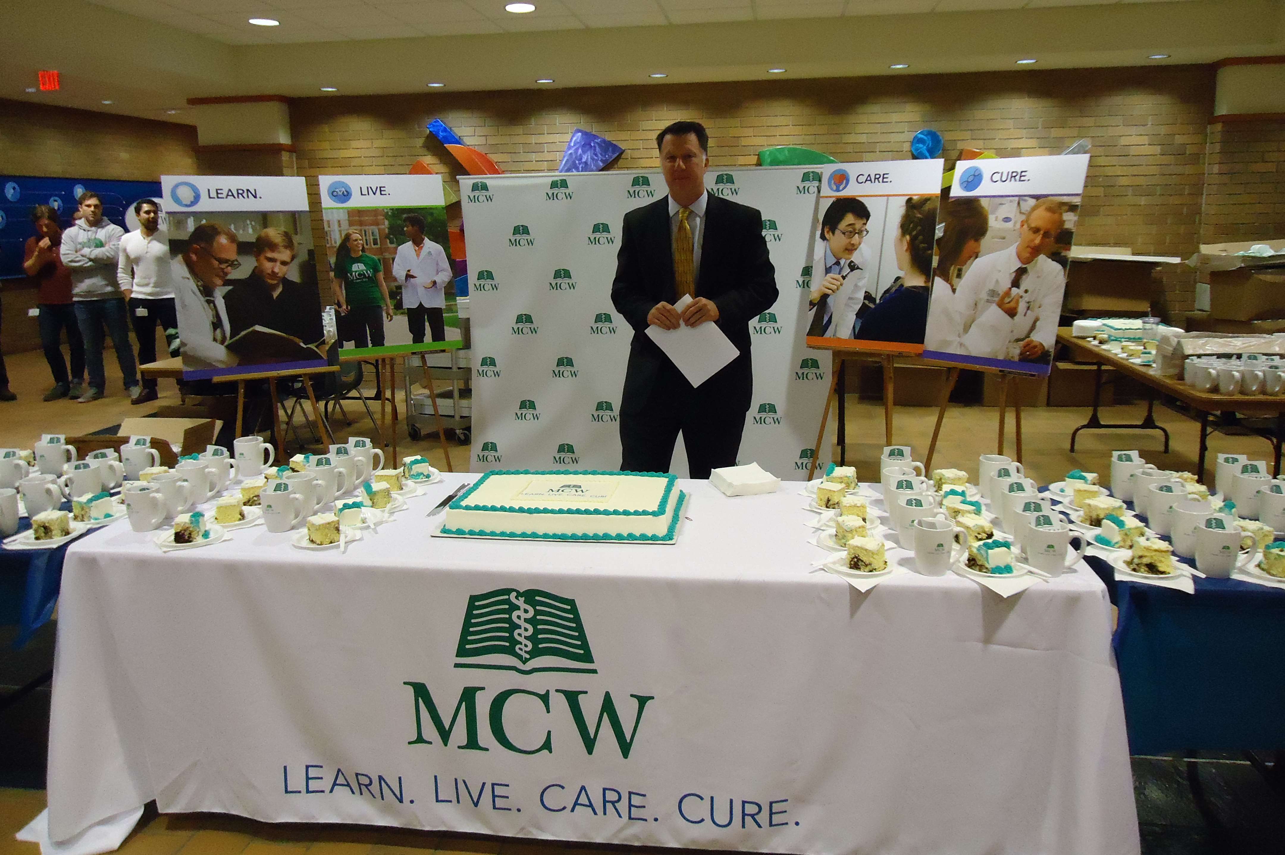 Dr. Joseph Kerschner at cake-cutting for MCW brand launch in 2018