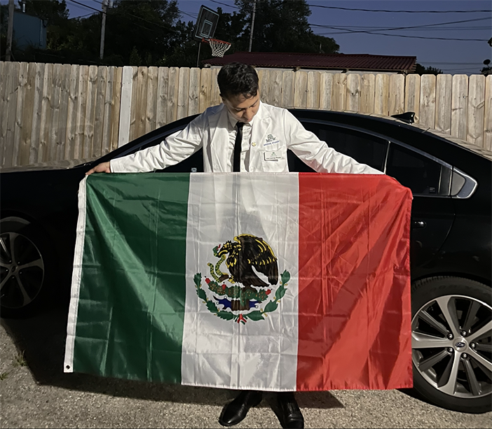 Jose Lizarraga Mazaba holding Mexican flag