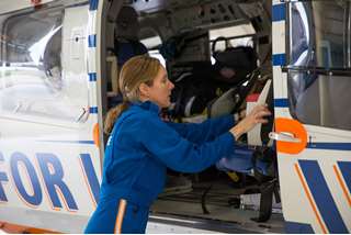 Linda Owens, flight nurse, preps helicopter for air medical services
