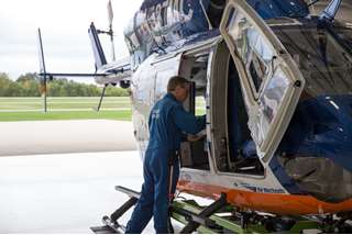 John Schindler, flight paramedic, runs through checklist before flight