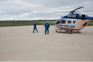 Flight For Life crew members prepare for takeoff from the Waukesha base 