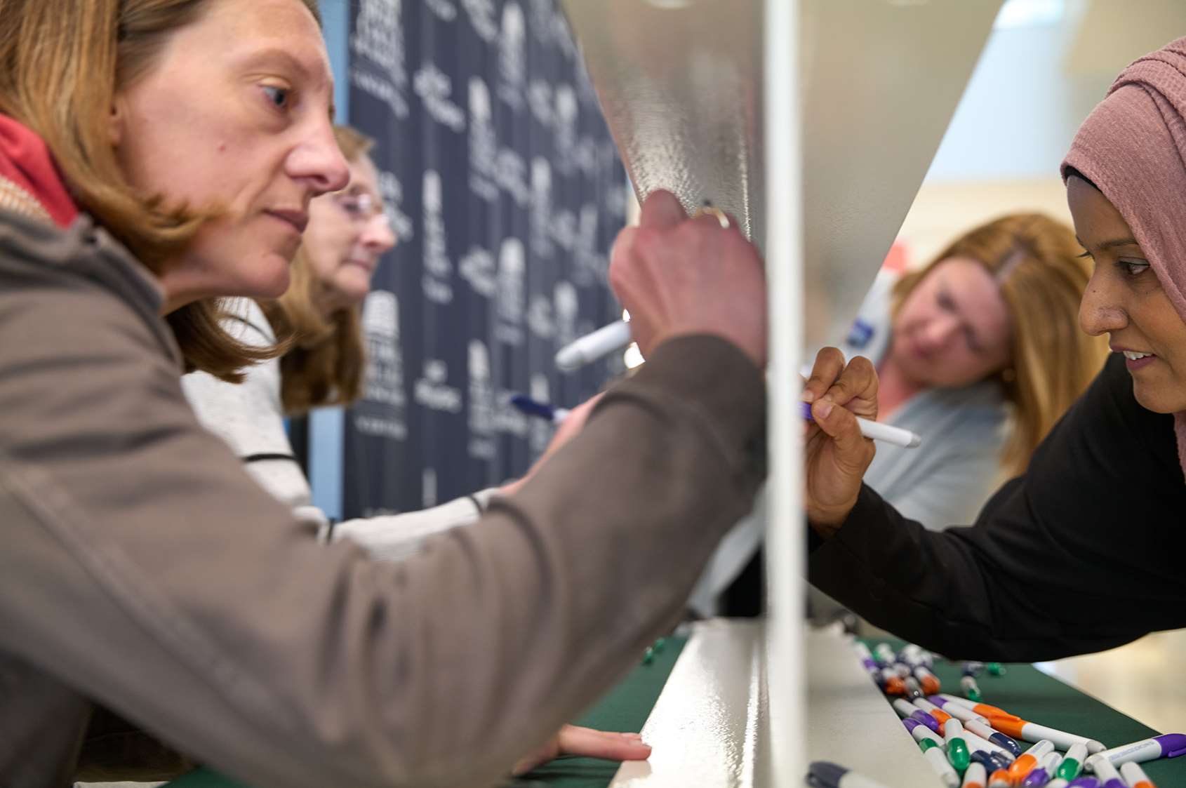 Attendees of beam signing event
