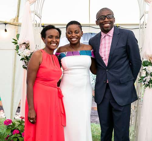 Elodie Ontala and her parents at her wedding