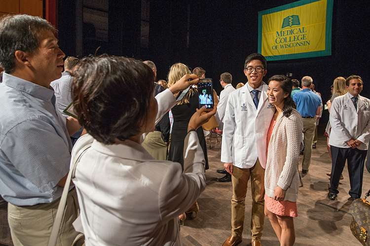 Matthew Kosasih's family celebrating his white coat ceremony