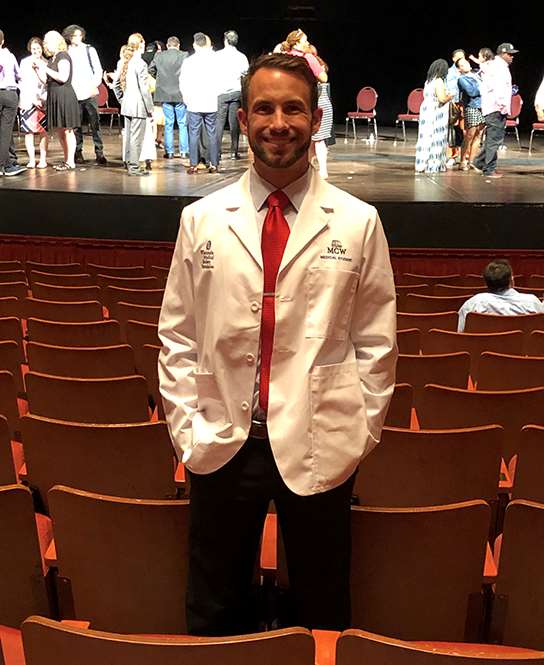 Chase LaRue standing in a theatre