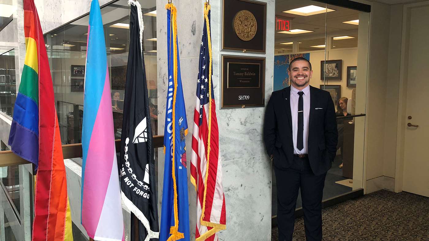 Thiago Arzua in front of US Senator Tammy Baldwin's office