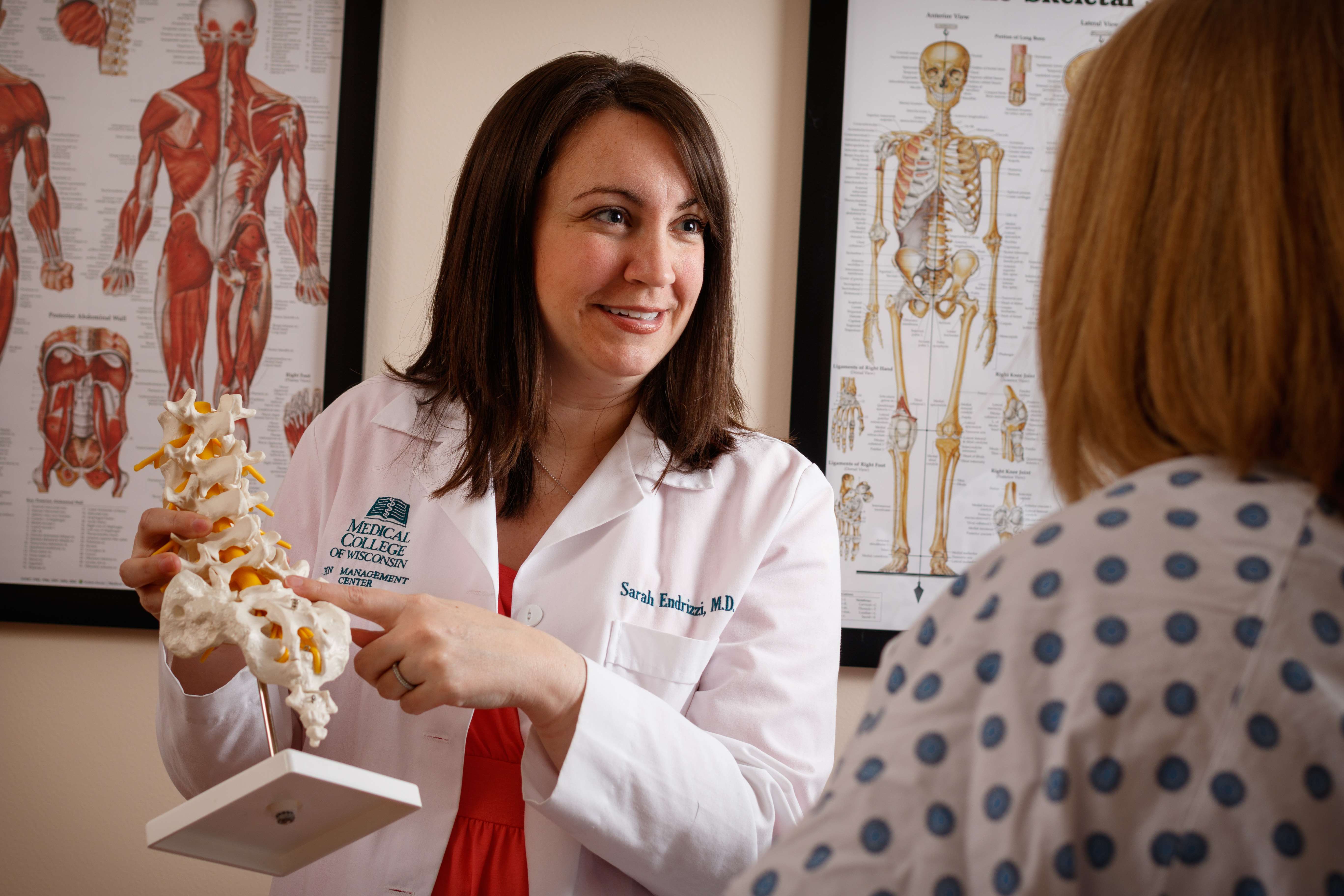 Pain medicine specialist Dr Endrizzi discussing back pain with a patient