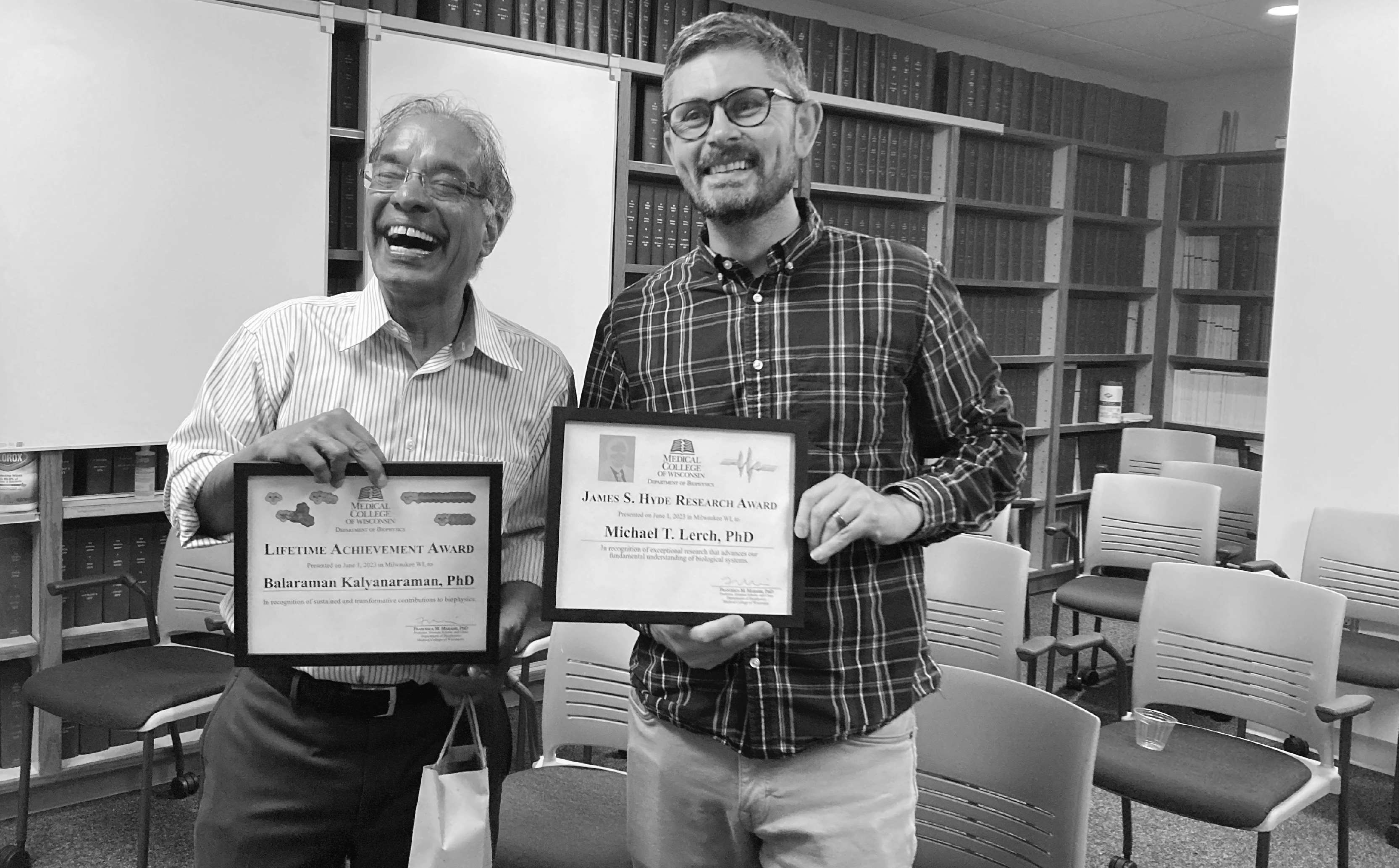 faculty posed with awards