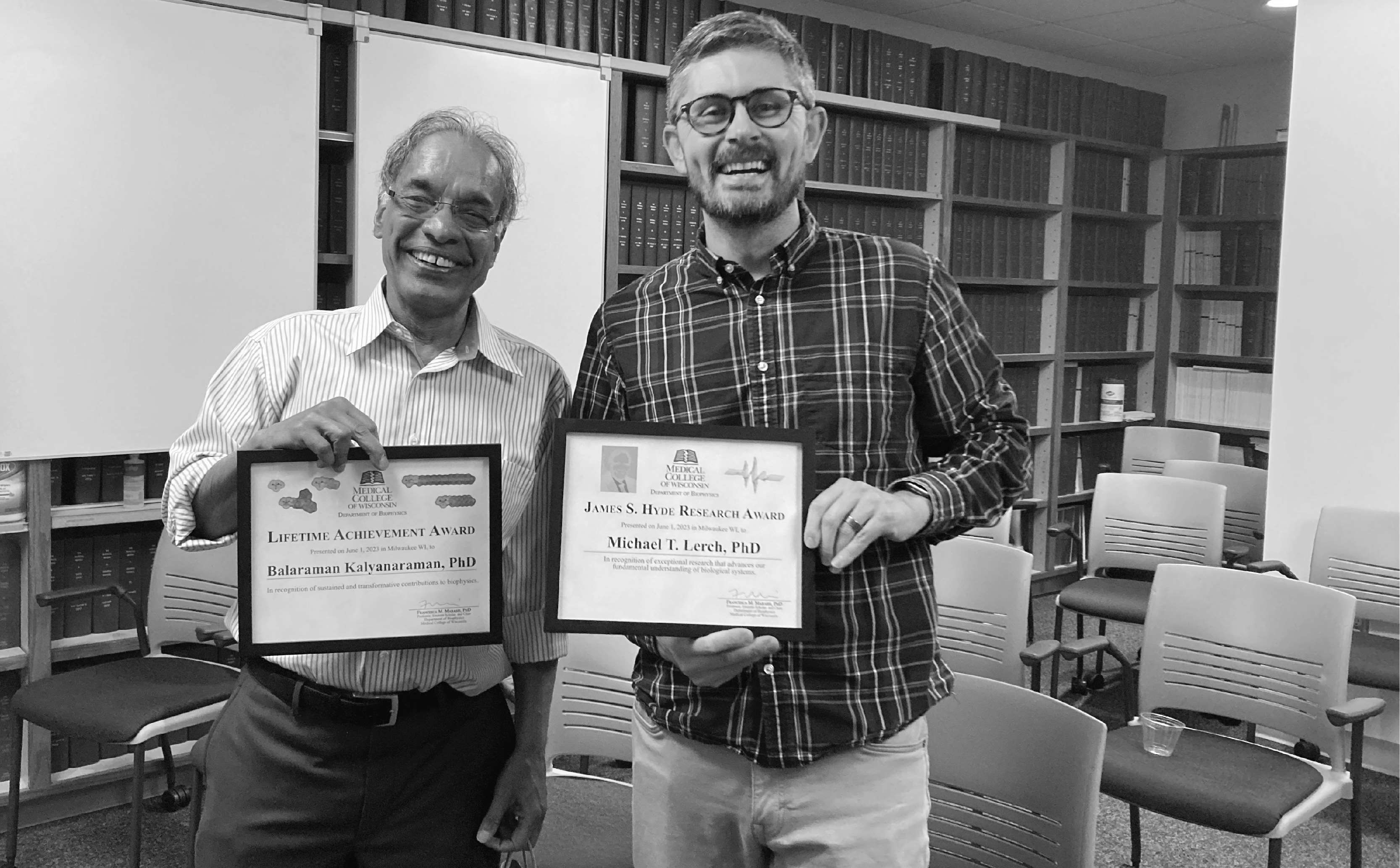 faculty posed with awards