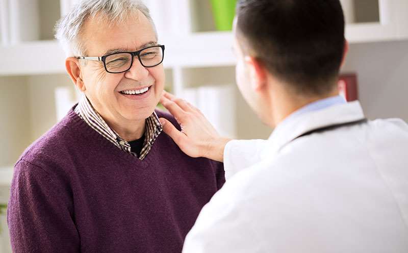 elderly man smiling with provider