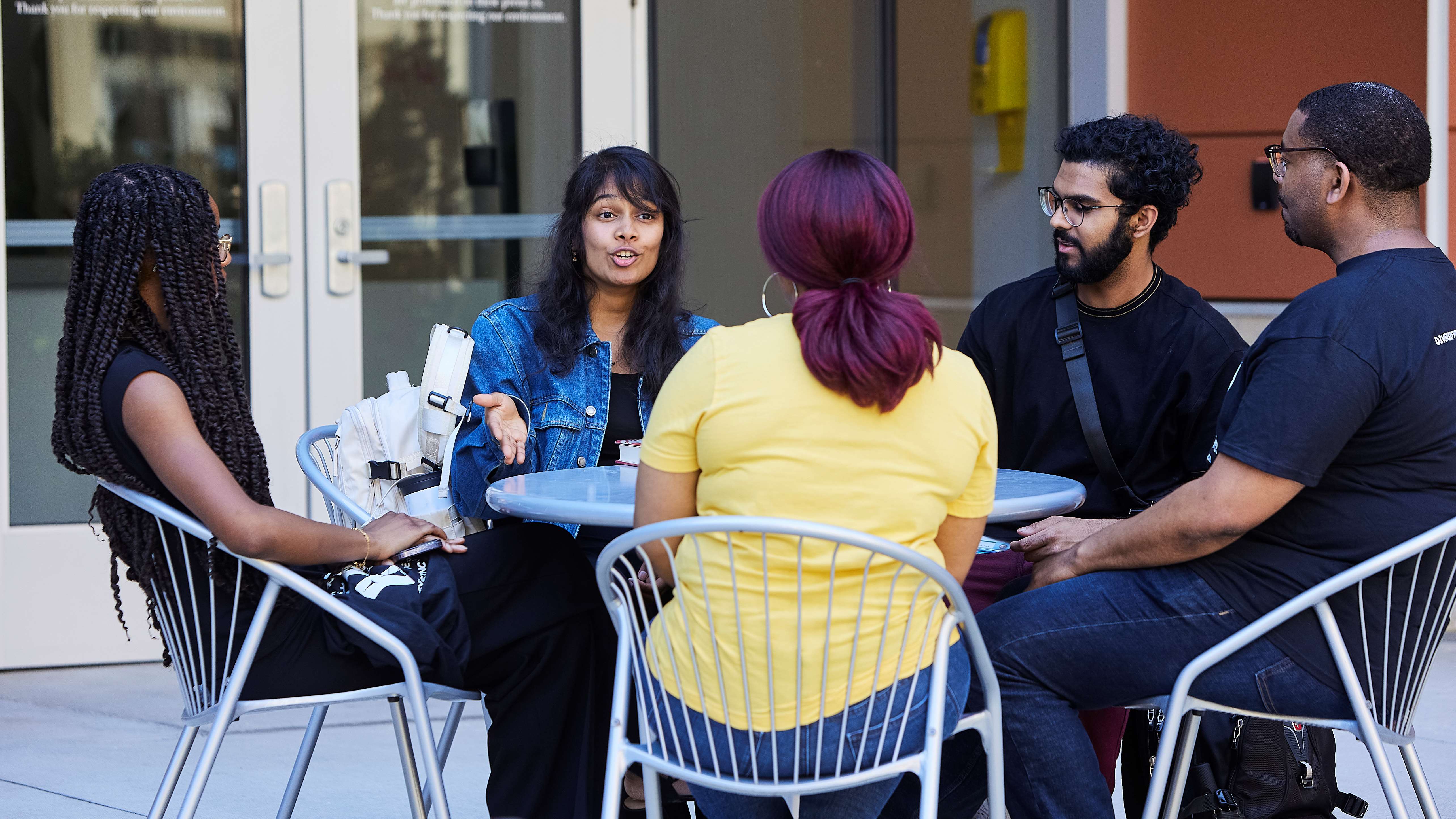 group of people sitting around a table