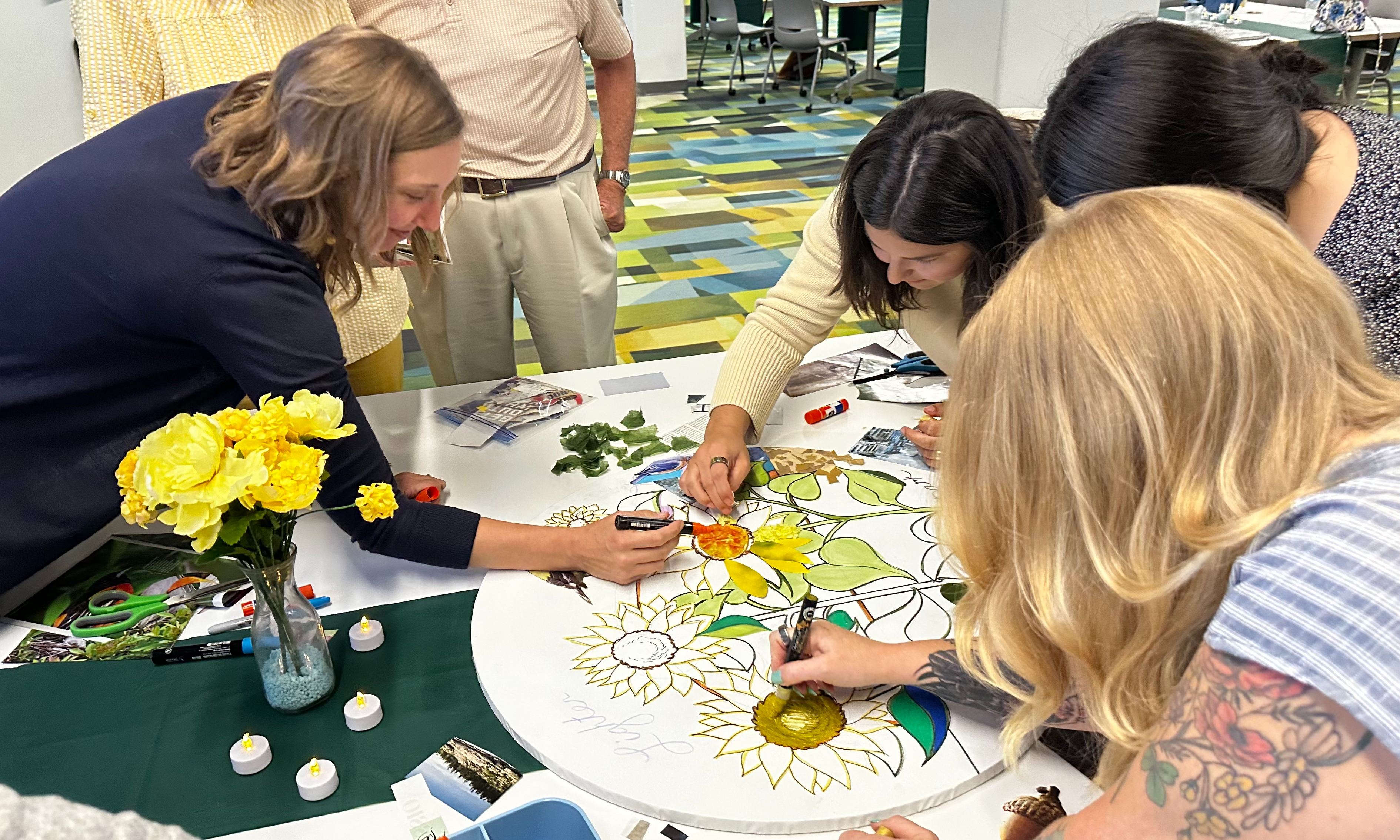 Postvention Course attendees coloring in a group