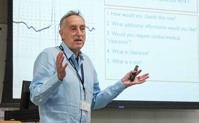 Man standing in front of classroom screen