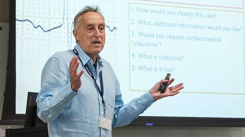Man standing in front of classroom screen