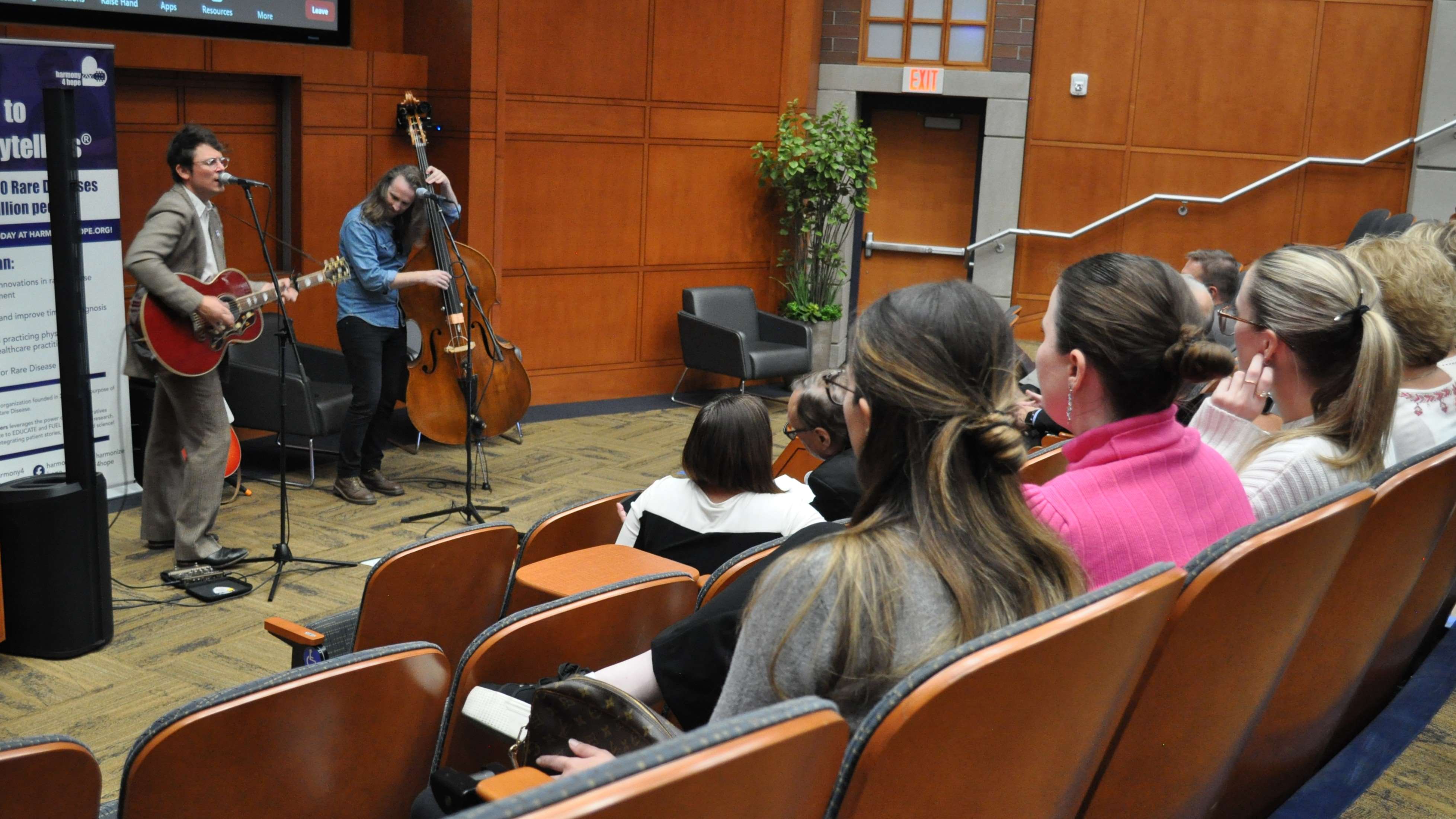 Musicians performing in auditorium at Rare Storytellers 2024