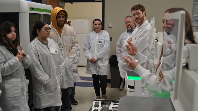 Students touring a research laboratory