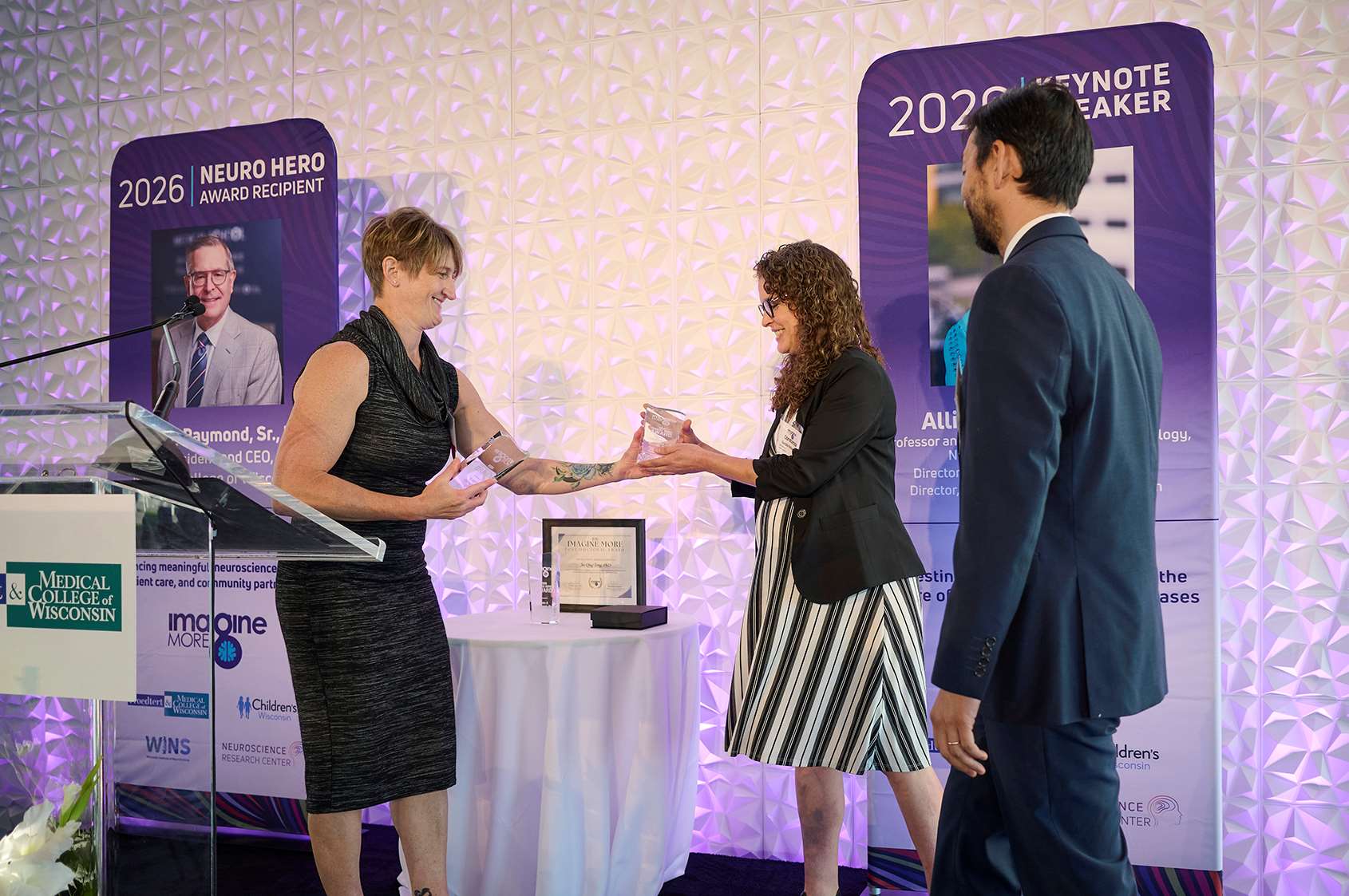 Allison D. Ebert, PhD, Director of the Neuroscience Research Center and Director of MCW’s Neuroscience Doctoral Program, presenting the 2026 Imagine More Award to recipients Constanza Garcia Keller, PhD, Assistant Professor in Department of Pharmacology and Toxicology; and Pablo Nakagawa, PhD, Assistant Professor in the Department of Physiology