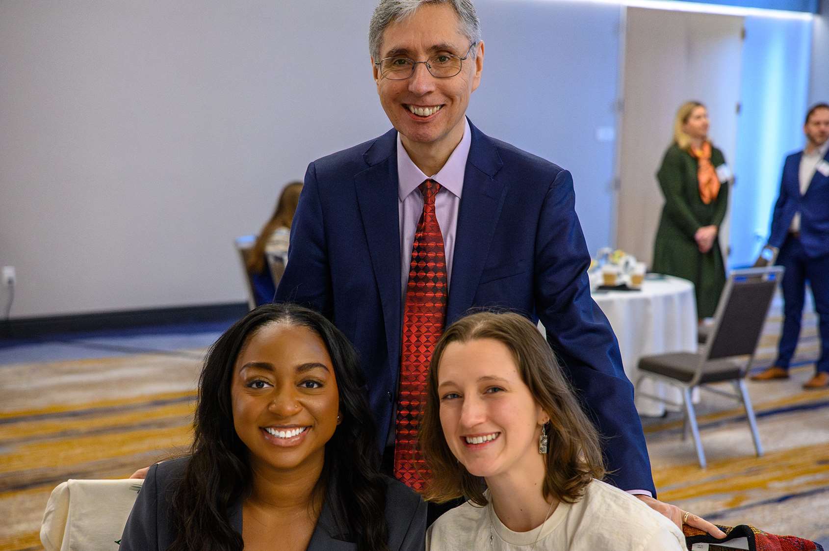 Chanté Butler (left) and Ellie Welsch with Dr. José Franco