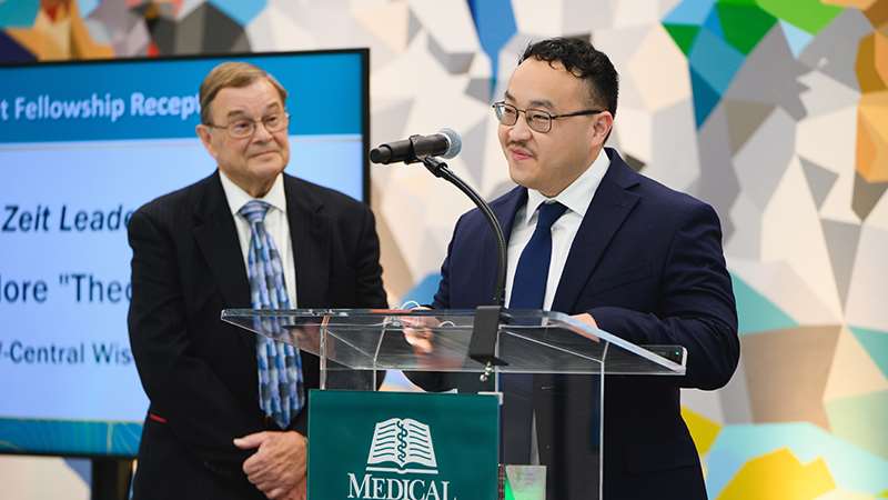 A man behind a podium giving a speech