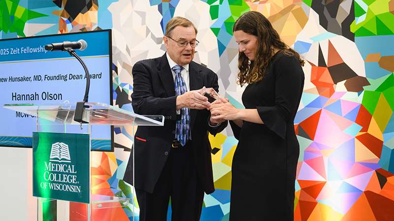 A woman receiving an award at an event