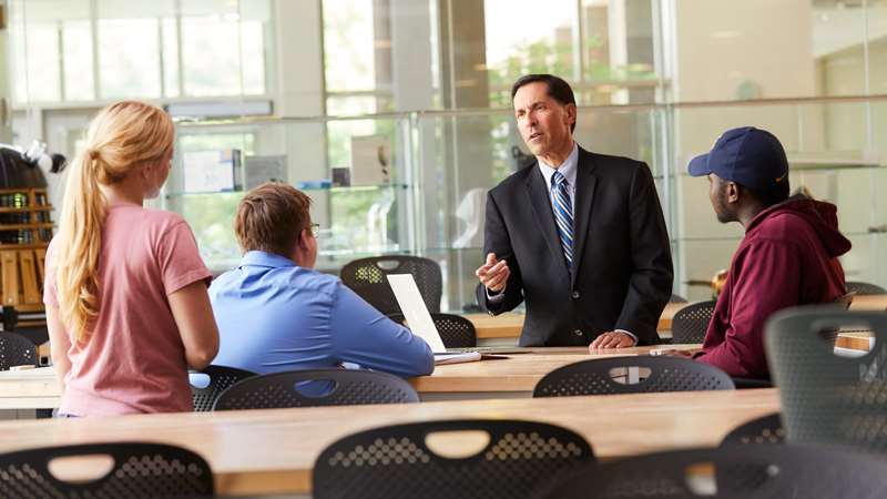 Dr. Goldberg speaks with students