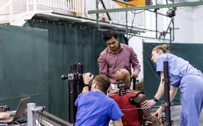 Somasundaram working with lab members in MCW's Trauma Biomechanics Lab