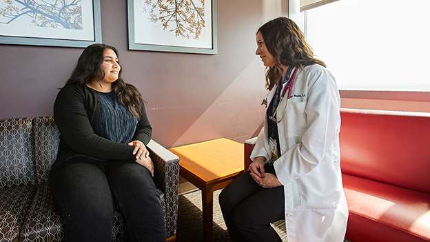 A female provider consulting with a female patient