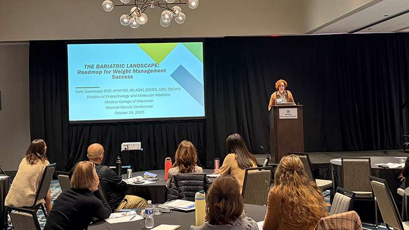 Presenter and attendees at a conference