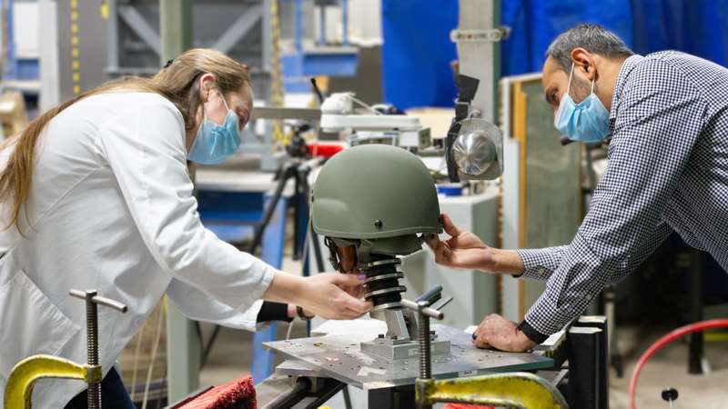 Engineers working helmet test in Yoganandan Lab