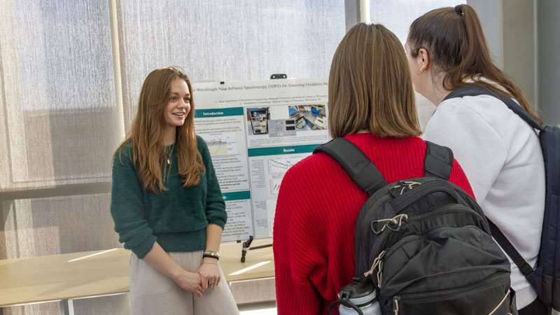 Student presenting research