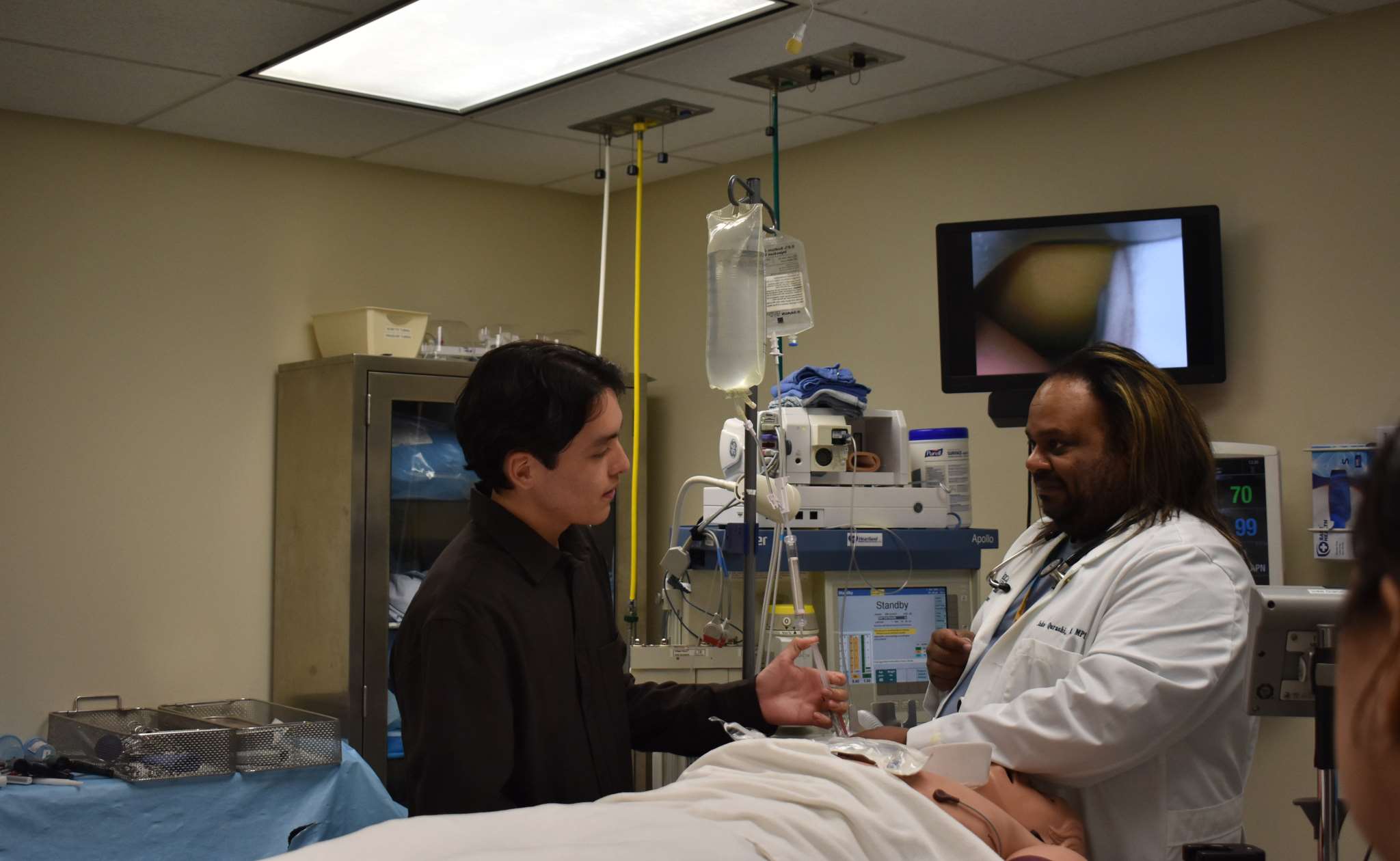 STEP-UP College Patient on table labcoat 2026
