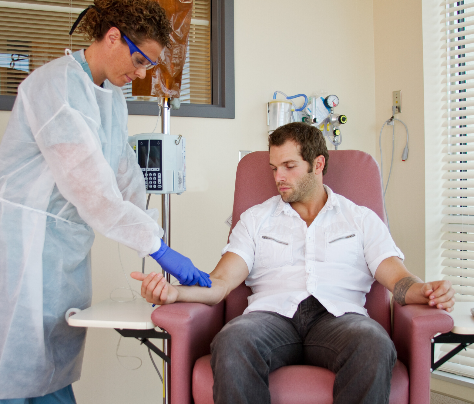 Nurse administering chemo.